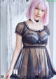 A woman with pink hair wearing a black lingerie.